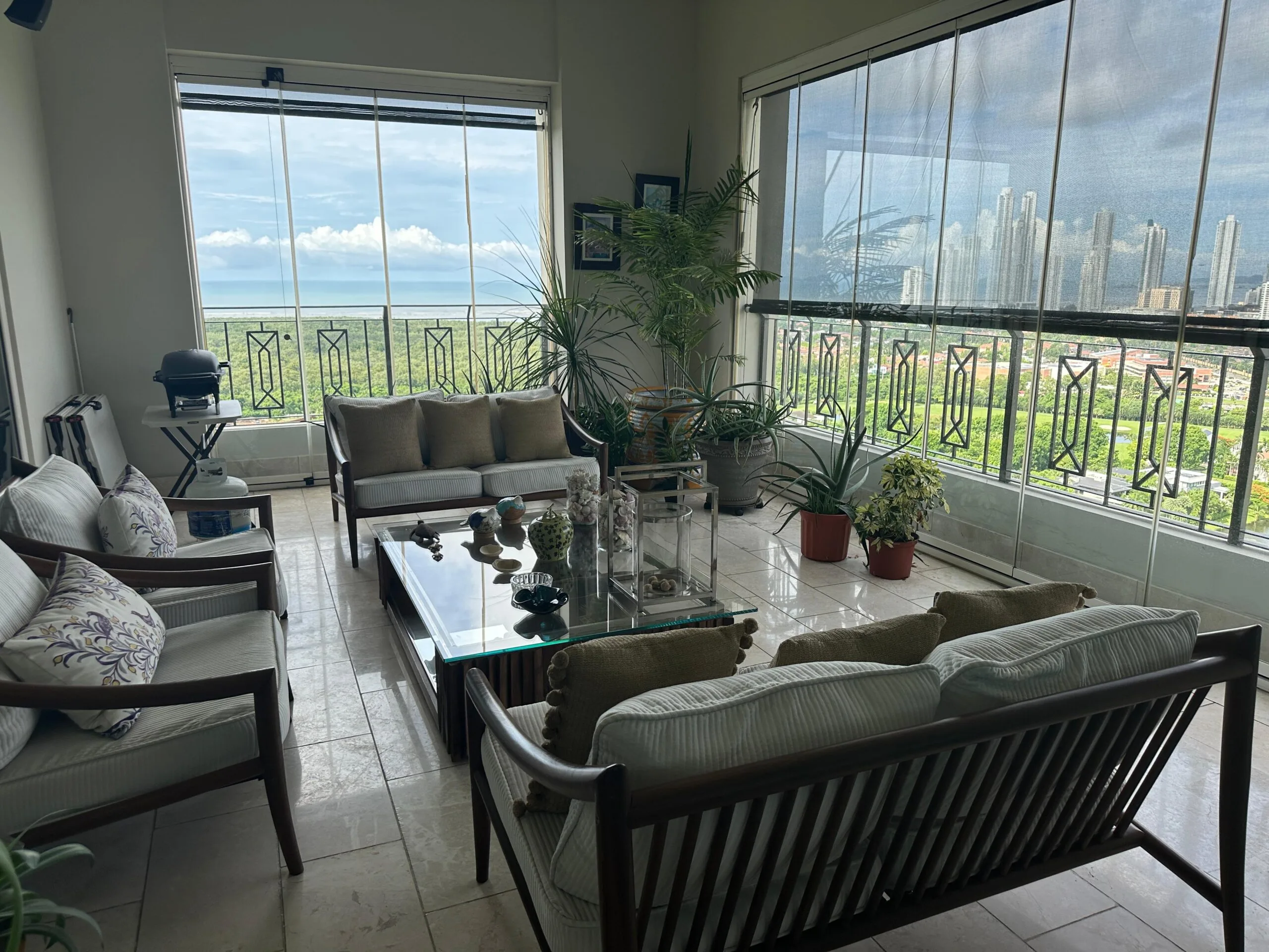 Enclosed terrace with panoramic city and ocean views in the 608 m² luxury apartment at Santa Maria Golf & Country Club, Panama City